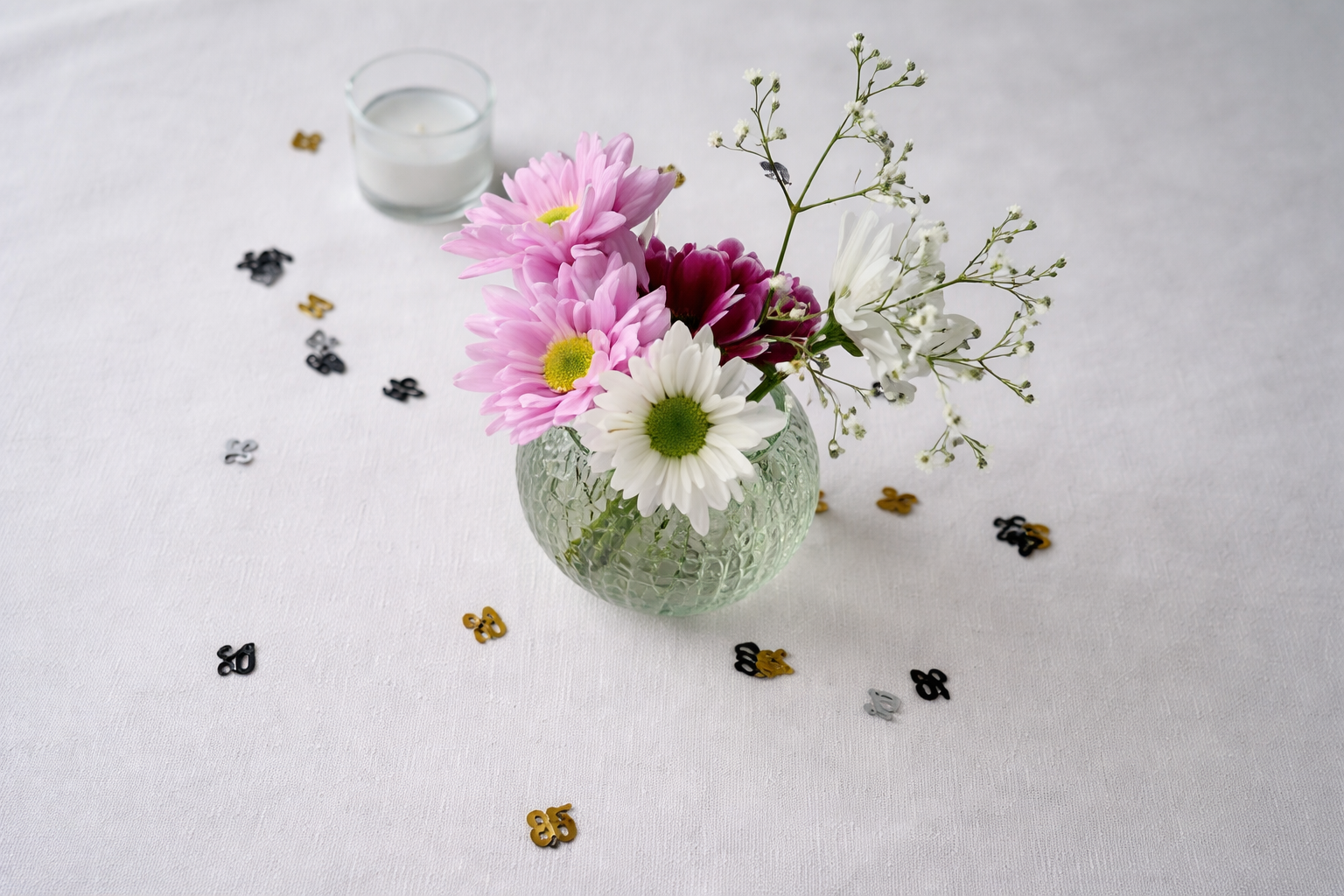 Floral bouquet with celebratory confetti